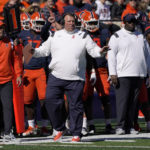 
              Illinois head coach Bret Bielema gestures on the sidelines during the first half of an NCAA college football game against Minnesota, Saturday, Oct. 15, 2022, in Champaign, Ill. (AP Photo/Charles Rex Arbogast)
            