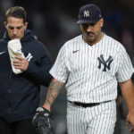 
              New York Yankees starting pitcher Nestor Cortes, right, leaves the game with an injury during the fourth inning of Game 4 of an American League Championship baseball series against the Houston Astros , Sunday, Oct. 23, 2022, in New York. (AP Photo/John Minchillo)
            