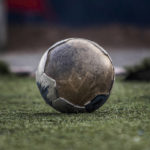 
              A worn-out soccer ball lies on the pitch during practice at the Goma Academy of Leaders in Goma, Democratic Republic of Congo, Oct. 24, 2022. Soccer has embarked on probably its most ambitious global youth development program, an ultimate goal of delivering millions of soccer balls and a coaching program to 700 million children aged between 4 and 14 across the world. The Football For Schools project was launched in 2019 but came to a grinding halt because of the COVID-19 pandemic. It has now been relaunched. (AP Photo/Moses Sawasawa)
            