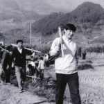 
              FILE - This photo provided by China's Xinhua News Agency shows Communist Party Leader Xi Jinping, right, then secretary of the Ningde Prefecture Committee of the Communist Party of China (CPC), participates in farm work during his investigation in the countryside in 1988. Chinese President Xi Jinping was the son of a communist revolutionary leader, a victim of the Cultural Revolution and a provincial leader who promoted economic growth before ascending to the very top a decade ago. (AP Photo/Xinhua, File)
            