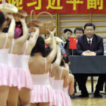 
              FILE - Chinese Vice President Xi Jinping watches the performing schoolgirls in the gymnasium of Hungarian-Chinese Bilingual Primary School in Budapest, Hungary, on Oct. 16, 2009. Chinese President Xi Jinping was the son of a communist revolutionary leader, a victim of the Cultural Revolution and a provincial leader who promoted economic growth before ascending to the very top a decade ago. (Laszlo Beliczay/MTI via AP, File)
            