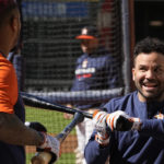 
              Houston Astros second baseman Jose Altuve, right, jokes with catcher Martin Maldonado during a practice ahead of Game 1 of baseball's American League Championship Series, in Houston, Tuesday, Oct. 18, 2022. (AP Photo/Eric Gay)
            