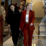 Assistant Public Defender Melisa McNeill along with other members of the defense team enter the courtroom as the jury begins their second day of deliberations in the Marjory Stoneman Douglas High School shooter Nikolas Cruz sentencing trial at the Broward County Courthouse in Fort Lauderdale on Thursday, Oct. 13, 2022. Cruz previously plead guilty to all 17 counts of premeditated murder and 17 counts of attempted murder in the 2018 shootings. (Mike Stocker/South Florida Sun Sentinel via AP, Pool)