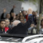 
              Former Brazilian President Luiz Inacio Lula da Silva, who is running for president again, waves to supporters after voting in the general election in Sao Paulo, Brazil, Sunday, Oct. 2, 2022. (AP Photo/Marcelo Chello)
            