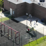 
              In this aerial image taken with a drone, patients play in a playground at Cumberland Hospital for Children and Adolescents Tuesday Sept. 20, 2022, in Richmond, Va. The office of Virginia Attorney General Jason Miyares handed off its jurisdiction in a long-running investigation into allegations of sexual misconduct and other abuses at a hospital. (AP Photo/Steve Helber)
            