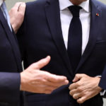 
              European Union leaders greet French President Emmanuel Macron during a round table meeting at an EU summit in Brussels, Friday, Oct. 21, 2022. European Union leaders are gathering Friday to take stock of their support for Ukraine after President Volodymyr Zelenskyy warned that Russia is trying to spark a refugee exodus by destroying his war-ravaged country's energy infrastructure. (AP Photo/Geert Vanden Wijngaert)
            