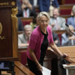 
              FILE- French Prime Minister Elisabeth Borne arrives to deliver a speech at the National Assembly, in Paris, France, Wednesday, July 6, 2022. The French government survived Monday two no-confidence votes prompted by opposition lawmakers to protest against the use of a special constitutional power to force the budget bill through the National Assembly without a vote. (AP Photo/Christophe Ena, File)
            
