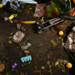Toys and personal items lay scattered on the floor of a bedroom, in a ground-floor river-front apartment which was flooded during the passage of Hurricane Ian, at the Riverwalk housing complex in Fort Myers, Fla., Wednesday, Oct. 5, 2022. According to a neighbor who aided in the rescue and preferred not to be identified, the family with two young children who lived there was trapped inside after flooding from the river burst down their front door, tearing the jam from the wall, and flooded the apartment to waist-height. Neighbors helped them to safety in a nearby second-story unit.(AP Photo/Rebecca Blackwell)