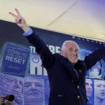 
              Conservative political consultant Roger Stone gestures victory to the cheering crowd during the ReAwaken America Tour at Cornerstone Church, in Batavia, N.Y., Friday, Aug. 12, 2022. (AP Photo/Carolyn Kaster)
            