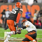 
              Cleveland Browns defensive end Myles Garrett (95) celebrates after sacking Cincinnati Bengals quarterback Joe Burrow, right, during the first half of an NFL football game in Cleveland, Monday, Oct. 31, 2022. (AP Photo/David Richard)
            