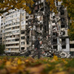 
              A man walks past a partially destroyed residential building at Saltivka neighbourhood in Kharkiv, Ukraine, Monday, Oct. 3, 2022. (AP Photo/Francisco Seco)
            
