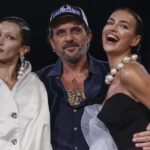 
              Bella Hadid, from left, designer Andreas Kronthaler and Irina Shayk pose after the Vivienne Westwood ready-to-wear Spring/Summer 2023 fashion collection presented Saturday, Oct. 1, 2022 in Paris. (Photo by Vianney Le Caer/Invision/AP)
            