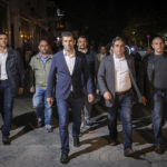 
              Kiril Petkov, left, flanked by Asen Vasilev of "We Continue the Change," walk near Alexander Nevsky Cathedral in Sofia, Bulgaria, after conceding defeat late Sunday, Oct. 2, 2022. An exit poll in Bulgaria suggested Sunday that the center-right GERB party of ex-premier Boyko Borissov, a party blamed for presiding over years of corruption, will be the likely winner of the country's parliamentary election. (AP Photo/Visar Kryeziu)
            