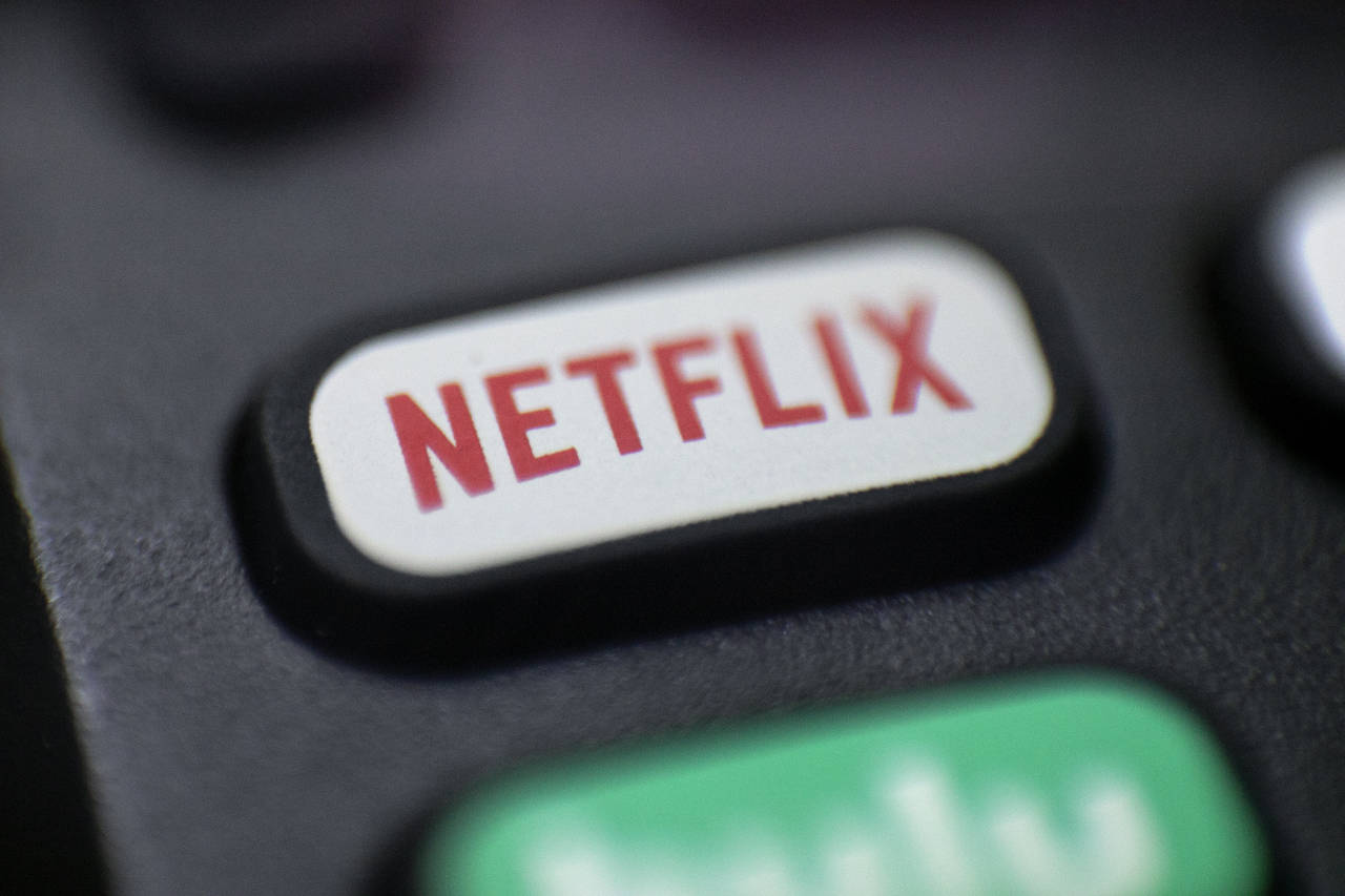 FILE - A logo for Netflix is seen on a remote control in Portland, Ore., on Aug. 13, 2020. Netflix ...