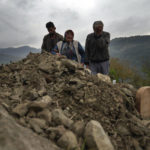 
              Habibe Ayvaz, 63, and Recep Ayvaz, 62, parents of the miner killed in a coal mine explosion, Selcuk Ayvaz, 33, weep over his grave in Amasra, in the Black Sea coastal province of Bartin, Turkey, Sunday, Oct. 16, 2022. (AP Photo/Khalil Hamra)
            