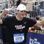 
              Ashton Kutcher crosses the finish line of the New York City Marathon, Sunday, Nov. 6, 2022, in New York. (AP Photo/Jason DeCrow)
            