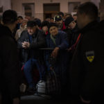 
              Ukrainians queue to board the Kherson-Kyiv train at the Kherson railway station, southern Ukraine, Monday, Nov. 21, 2022. Ukrainian authorities are evacuating civilians from recently liberated sections of the Kherson and Mykolaiv regions, fearing that a lack of heat, power and water due to Russian shelling will make conditions too unlivable this winter. The move came as rolling blackouts on Monday plagued most of the country. (AP Photo/Bernat Armangue)
            