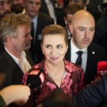 
              Denmark's Prime Minister and head of the Social Democratic Party Mette Frederiksen talks with media members after the country's general election night at the party in Copenhagen, Denmark, early Wednesday, Nov. 2, 2022. Frederiksen was in a strong position to remain in power after her Social Democrats won the most votes in Denmark election Tuesday and a center-left bloc in Parliament that backs appeared set to retain a majority by just one seat. (AP Photo/Sergei Grits)
            