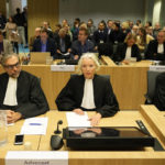 
              Peter Langstraat, left, along with other lawyers of the victims sit in court before the verdict session of the Malaysia Airlines Flight 17 trial at the high security court at Schiphol airport, near Amsterdam, Netherlands, Thursday, Nov. 17, 2022. The Hague District Court, sitting at a high-security courtroom at Schiphol Airport, is passing judgment on three Russians and a Ukrainian charged in the downing of Malaysia Airlines flight MH17 over Ukraine and the deaths of all 298 passengers and crew on board, against a backdrop of global geopolitical upheaval caused by Russia's full-blown invasion of Ukraine in February and the nearly nine-month war it triggered. (AP Photo/Phil Nijhuis)
            