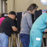 
              Voters casting their ballots during the midterm elections in Miami-Dade County at the Miami Beach Fire Department - Station 4 on Tuesday, Nov. 8, 2022 in Miami Beach, Fla. (David Santiago/Miami Herald via AP)
            