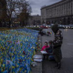 
              Ukrainian flags are placed in memory of those killed during the war near Maidan Square in central Kyiv, Ukraine, Friday, Nov. 11, 2022. (AP Photo/Bernat Armangue)
            