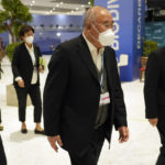 
              Xie Zhenhua, China's special envoy for climate, walks through the COP27 U.N. Climate Summit, Sunday, Nov. 20, 2022, in Sharm el-Sheikh, Egypt. (AP Photo/Peter Dejong)
            