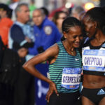 
              Gotytom Gebreslase, left, and Viola Cheptoo, right, talk before the start of the women's professional division of the New York City Marathon, Sunday, Nov. 6, 2022, in New York. (AP Photo/Julia Nikhinson)
            