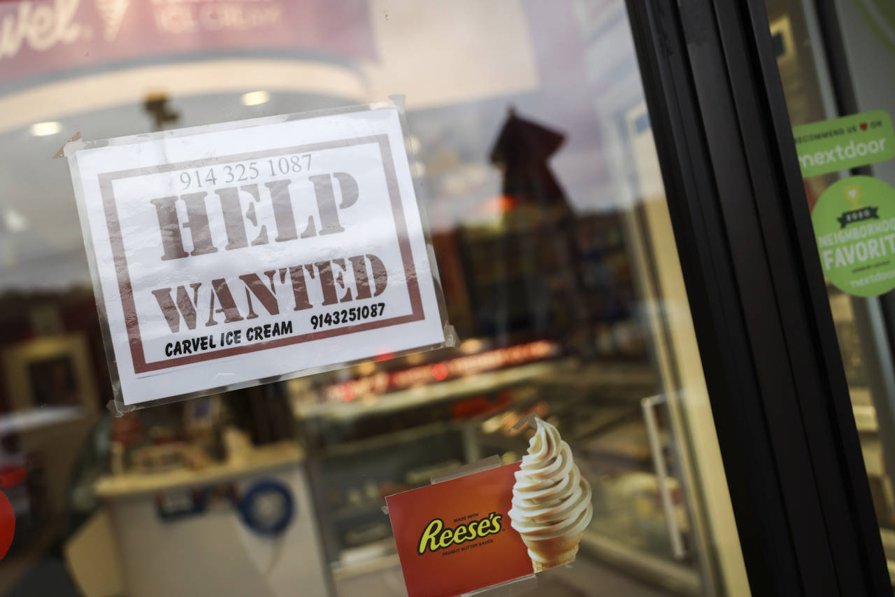 A help wanted sign in a storefront, Tuesday, Nov. 1, 2022, in Bedford, N.Y. The Federal Reserve may...