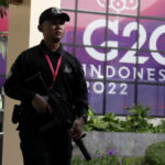 
              An Indonesian soldier walks past a G20 sign at one of the venues of the G20 leaders summit, in Nusa Dua, Bali, Indonesia, Monday, Nov. 14, 2022. (AP Photo/Dita Alangkara)
            
