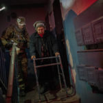 
              Elderly residents are evacuated from the southern city of Kherson, Ukraine, Sunday, Nov. 27, 2022. Shelling by Russian forces struck several areas in eastern and southern Ukraine overnight as utility crews continued a scramble to restore power, water and heating following widespread strikes in recent weeks, officials said Sunday. (AP Photo/Bernat Armangue)
            