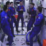 
              In this photo released by Xinhua News Agency, an image captured off a screen at the Jiuquan Satellite Launch Center in northwest China shows the Shenzhou-15 and Shenzhou-14 crew chatting after a historic gathering in space on Wednesday, Nov. 30, 2022. Three Chinese astronauts docked early Wednesday with their country's space station, where they will overlap for several days with the three-member crew already onboard and expand the facility to its maximum size. (Guo Zhongzheng/Xinhua via AP)
            