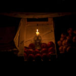 
              A candle illuminates a market fruit stall during a power outage in central Kyiv, Ukraine, Wednesday, Nov. 9, 2022. (AP Photo/Bernat Armangue)
            