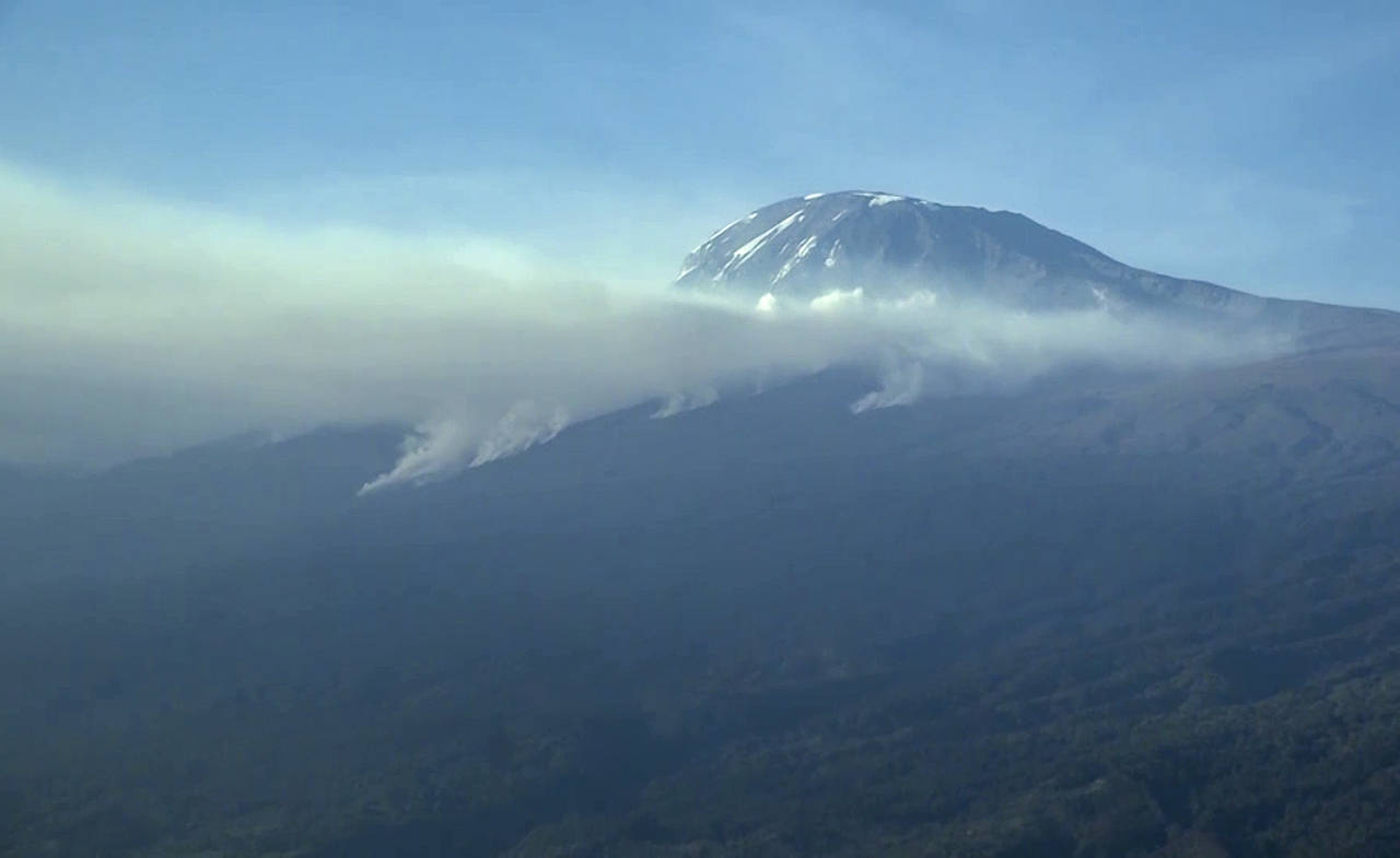 This image made from video shows smoke rising from the slopes of Mt. Kilimanjaro in Tanzania Sunday...