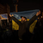 
              Ukrainians gather in central Kyiv to celebrate the recapturing of Kherson city, Ukraine, Friday, Nov. 11, 2022. (AP Photo/Bernat Armangue)
            