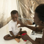 
              A mother hydrates her son who is stricken with cholera, at a clinic run by Doctors Without Borders in Port-au-Prince, Haiti, Friday, Nov. 11, 2022. (AP Photo/Odelyn Joseph)
            