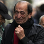 
              A man reacts by a memorial at the scene of Sunday's explosion on Istanbul's popular pedestrian Istiklal Avenue in Istanbul, Monday, Nov. 14, 2022. Turkey's interior minister says police have detained a suspect who is believed to have planted the bomb that exploded on a bustling pedestrian avenue in Istanbul. He said Monday that initial findings indicate that Kurdish militants were responsible for the attack. (AP Photo/Khalil Hamra)
            