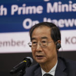 
              South Korean Prime Minister Han Duck-soo answers a reporter's question during a foreign media briefing in Seoul, South Korea, Tuesday, Nov. 1, 2022. South Korea's police chief admitted "a heavy responsibility" for failing to prevent a recent crowd surge that killed more than 150 people during Halloween festivities in Seoul, saying Tuesday that officers didn't effectively handle earlier emergency calls about the impending disaster. (AP Photo/Lee Jin-man)
            