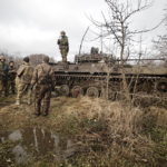 
              Ukrainian servicemen take positions on the frontline at an undisclosed location in the Donetsk region, Ukraine, Friday, Nov. 24, 2022. (AP Photo/Roman Chop)
            