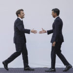 
              Britain's Prime Minister Rishi Sunak reaches to shake hands with President of France, Emmanuel Macron, ahead of a bilateral meeting, during the COP27 summit, in Sharm el-Sheikh, Egypt, Monday, Nov. 7, 2022. Nearly 50 heads of states or governments on Monday will take the stage in the first day of “high-level” international climate talks in Egypt with more to come in the following days. (Stefan Rousseau/Pool Photo via AP)
            