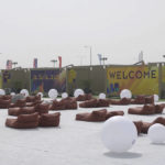 
              In this photo taken from video, a view of large bean-bag style chairs are seen in front of accommodation cabins in the fan village in Doha, Qatar, Wednesday, Nov. 9, 2022. Qatar on Wednesday unveiled a 6,000-cabin fan village in an isolated lot near its international airport, an offering for housing toward the lower end of what's available for the upcoming World Cup just days away from starting. (AP Photo/Lujain Jo)
            