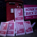 
              Placards piled up for postal workers from the Communication Workers Union (CWU) on the picket line at the Camden Town Delivery Office in north west London, Thursday, Nov. 24, 2022. Thousands of postal workers, university lecturers and schoolteachers in the U.K. are going on strike to demand better pay and working conditions amid the country's cost-of-living crisis. (Yui Mok/PA via AP)
            