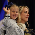 
              Four-year-old Greta McGarvey waves to the crowd as her mother, Chris, holds her during Morgan McGarvey's victory speech in Louisville, Ky., Tuesday, Nov. 8, 2022. McGarvey won in the state's 3rd Congressional District. (AP Photo/Timothy D. Easley)
            