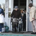 
              Elderly evacuees from Kherson leave their geriatric boarding house to move to the Crimea, southern Ukraine, Saturday, Nov. 5, 2022. Russian authorities have encouraged residents of Kherson to evacuate, warning that the city may come under massive Ukrainian shelling. (AP Photo)
            