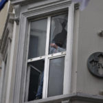 
              A man removes broken glass caused by  Sunday's explosion on Istanbul's popular pedestrian Istiklal Avenue in Istanbul, Monday, Nov. 14, 2022. Turkey's interior minister says police have detained a suspect who is believed to have planted the bomb that exploded on a bustling pedestrian avenue in Istanbul. He said Monday that initial findings indicate that Kurdish militants were responsible for the attack. (AP Photo/Khalil Hamra)
            