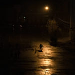 
              People walk across a street during a blackout in Kyiv, Ukraine, Sunday, Nov. 6, 2022. (AP Photo/Andrew Kravchenko)
            