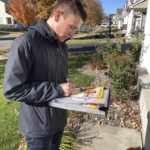 Matt Norris, a Democratic candidate for the Minnesota House, knocks on doors to seek votes in Blaine, Minn., on Wednesday, Oct. 26, 2022. (AP Photo/Steve Karnowski)