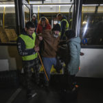 
              A volunteer helps an elderly evacuee from Kherson to leave a bus upon their arrive to Dzhankoi, Crimea, Thursday, Nov. 10, 2022. Russian Defense Minister Sergei Shoigu ordered a troop withdrawal from Kherson and nearby areas on Wednesday after his top general in Ukraine reported that a loss of supply routes during Ukraine's southern counteroffensive made a defense "futile." (AP Photo)
            