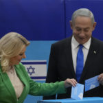 
              Likud party chairman Benjamin Netanyahu and his wife 'Sara cast their ballots during Israeli elections in Jerusalem, Tuesday, Nov. 1, 2022. (AP Photo/Maya Alleruzzo)
            