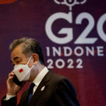
              China's Foreign Minister Wang Yi talks on the phone during the handover ceremony at the G20 Leaders' Summit in Nusa Dua, Bali, Indonesia, Wednesday, Nov. 16, 2022. (Willy Kurniawan/Pool Photo via AP)
            
