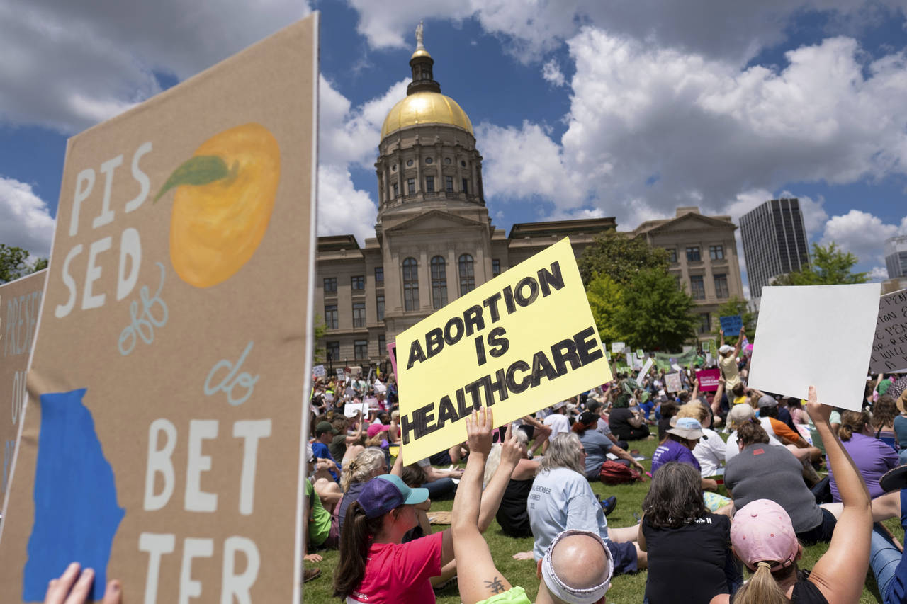 FILE - Abortion rights protesters rally near the Georgia state Capitol in Atlanta on May 14, 2022. ...